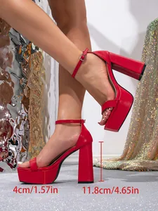 Close-up detail of red square-toe platform sandals showing the 11.8cm high block heel