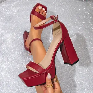 Elegant burgundy square toe platform sandals with chunky high heels and ankle strap.