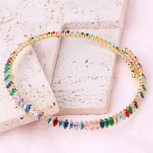 Close-up of gold-plated necklace with vibrant multi-colored marquise-cut cubic zirconia