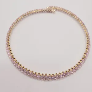 Detailed view of an elegant gold-plated necklace with pink oval-cut cubic zirconia