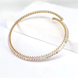 Detail view of gold-plated choker necklace with full marquise-cut clear zircons