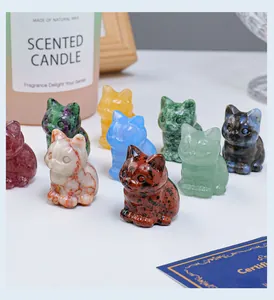 Group of small hand-carved natural crystal stone cat figurines in diverse colors and textures