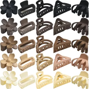 Set of matte hair claw clips in neutral earth tones with assorted geometric shapes
