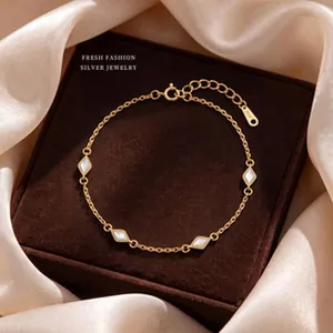 Detail of elegant gold s925 silver bracelet with diamond mother of pearl inlays.