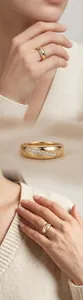 Close-up of gold-plated 925 silver ring with seven moissanite stones on a hand