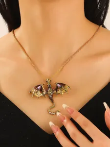 Detail close-up of a vintage enamel dragon pendant necklace with sparkling crystal gems