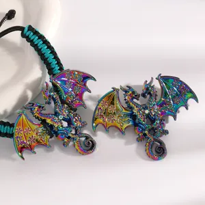 Detailed view of iridescent enamel dragon bracelet and brooch set for men and women.