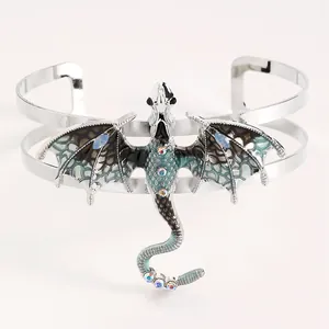Close-up detail of vintage silver enamel dragon cuff bracelet with sparkly crystals