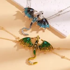 Close-up of exquisite enamel dragon pendants with sparkling rhinestone accents on chains.