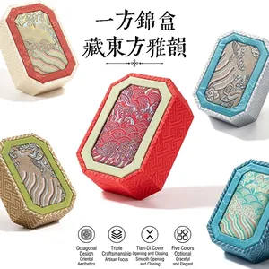 Detailed view of various colors of traditional Chinese octagonal jewelry brocade gift boxes