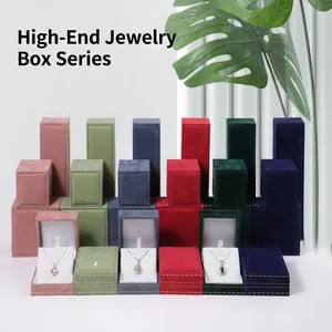 Collection of premium velvet jewelry boxes in multiple colors for rings necklaces and bracelets