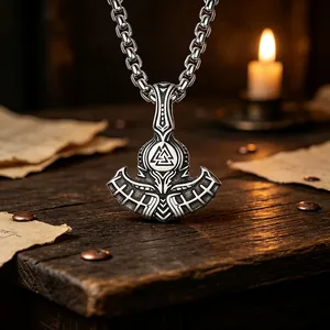 Close-up of retro stainless steel Thor's axe pendant with Valknut symbol for men.