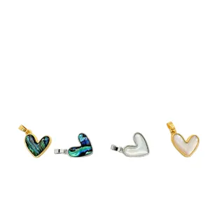 Set of four heart-shaped pendants with natural shell inlays in gold and silver finishes