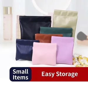 Multi-colored PU leather squeeze top pouches for storing small jewelry and accessories