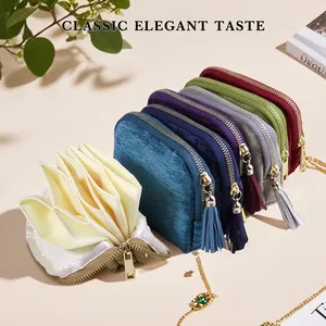 Detailed view of colorful velvet jewelry pouches with multi-layer interior