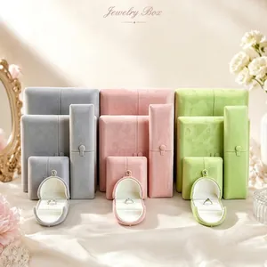 Premium velvet jewelry storage boxes in grey, pink, and green for rings and necklaces