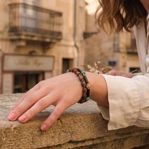 Detail shot of handmade bohemian bracelets featuring semi-precious stones and Czech beads