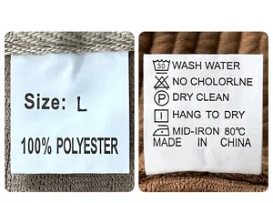 Detail of clothing care label showing 100% polyester material and wash instructions