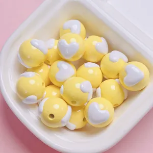 Adorable yellow round beads with white heart patterns for DIY phone chains and jewelry
