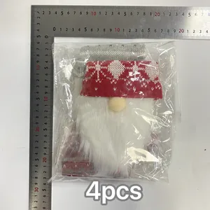 Close-up of knit Christmas gnome wine bottle cover with measurement ruler and 4pcs label