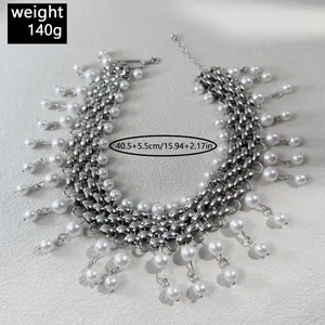 Close-up view of silver punk chain necklace with hanging pearls and dimensions