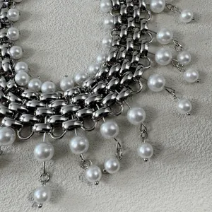 Detailed close-up of a silver punk chunky chain necklace featuring white pearl charms.