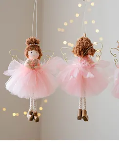 Detail view of pink mesh skirt angel doll ornaments with golden wire wings for Christmas