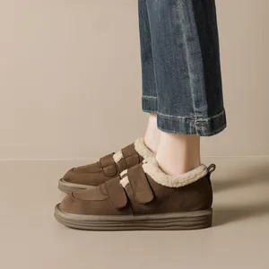 Women's thick-soled brown snow boots with plush lining and Velcro straps for winter