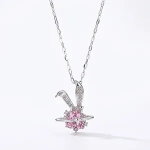 Silver rabbit pendant necklace with pink heart crystal and Saturn ring detail