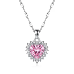 Close-up of a silver-toned necklace featuring a large pink heart-shaped crystal pendant
