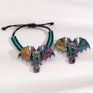 Detailed close-up of a vintage double-headed dragon bracelet with colorful enamel wings