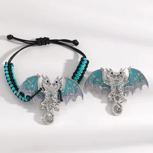 Retro silver flying dragon jewelry set with blue enamel wings and braided bracelet detail