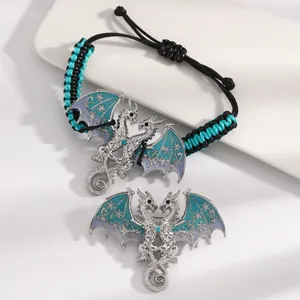 Vintage flying dragon braided bracelet and brooch set with blue enamel wings and rhinestones