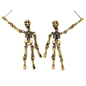 Close-up view of antique gold-finish punk gothic skeleton dangling earrings for women