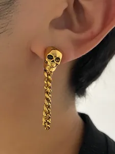 Gothic gold skull drop earrings with long curb chain for a punk look