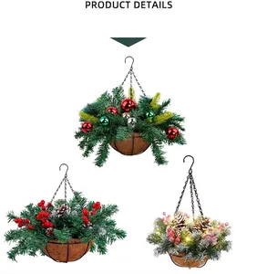 Set of three artificial Christmas hanging baskets with evergreen branches, red berries and ornaments.