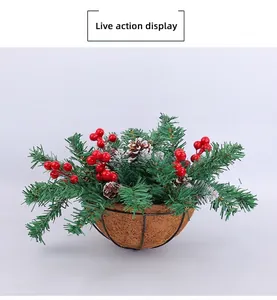 Detailed view of artificial Christmas hanging basket with pine needles and red berries