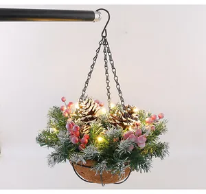 Detailed view of an artificial Christmas hanging basket with LED lights and pine cones