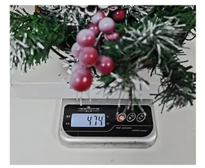 Artificial Christmas hanging basket weight measurement showing 474g on digital scale