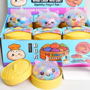 Detailed view of maltose squishy bun fidget toys in yellow steamer baskets