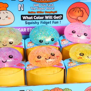 Variety of colorful glittery bun squishy toys with cute faces on yellow steamer bases