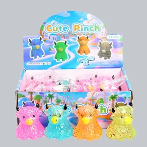 Detailed view of colorful glitter bull squeeze toys inside a 12-piece product display box