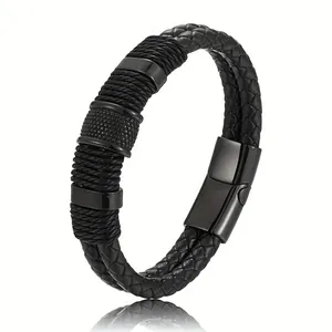 Macro view of men's multi-layer black woven leather bracelet with magnetic clasp