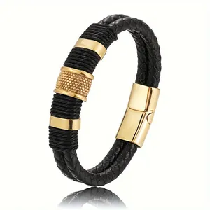 Detailed view of the black braided leather texture and gold magnetic clasp of the men's bracelet.