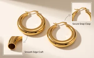 Close-up of chunky gold-plated hoop earrings featuring a secure snap clasp and smooth finish