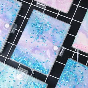 Detail view of A5 starry binder with blue heart-shaped sequins and galaxy cover