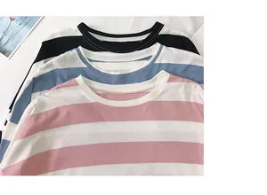 Detailopname van drie casual gestreepte shirts met lange mouwen in roze, blauw en zwart kleur