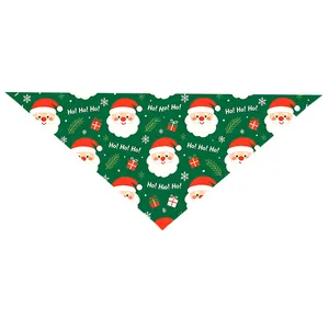 Festive Christmas pet bandana with Santa Claus and gift box patterns on green fabric
