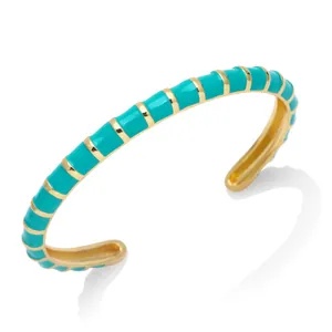 Bohemian turquoise enamel cuff bracelet featuring a gold-tone bamboo segmented design