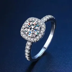 Close-up detail of a classic silver square halo princess ring with brilliant round stone
